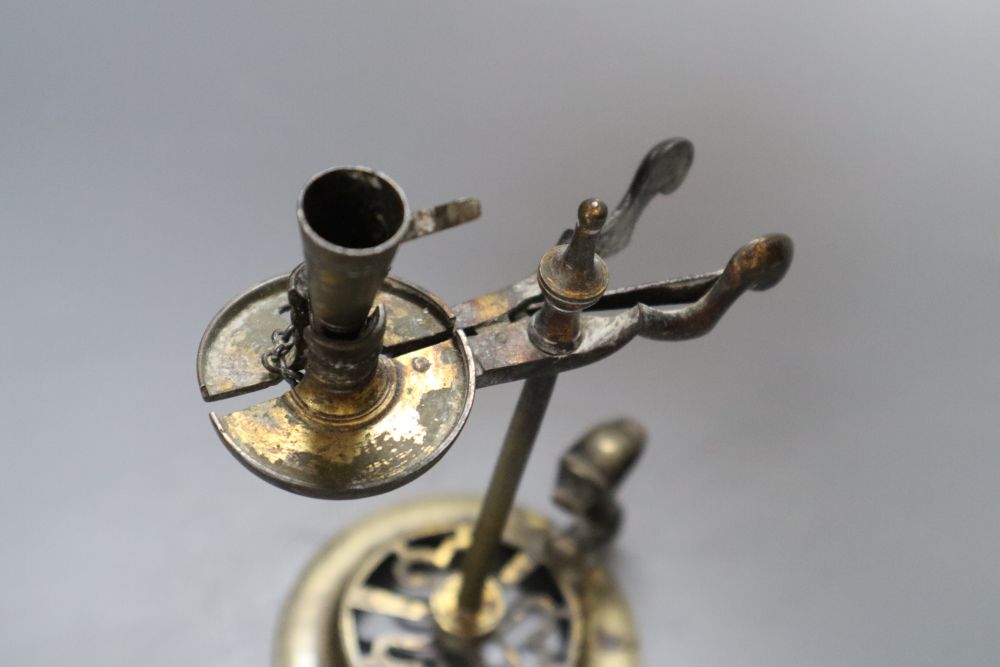 A 19th century brass waxjack, with attached extinguisher, 14cm high